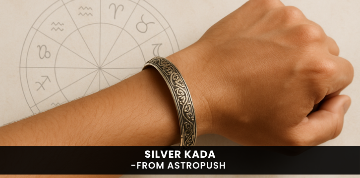 Intricately designed silver kada on wrist symbolizing strength, style, and spiritual energy in an astrological context.